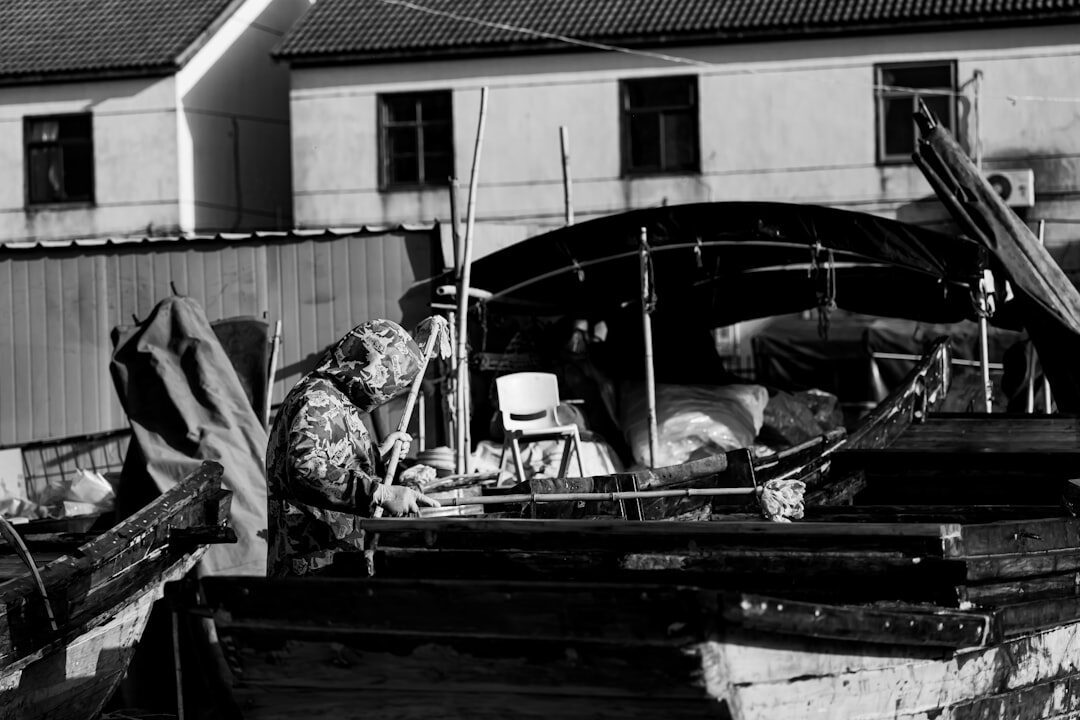 fishermen repairing boat
