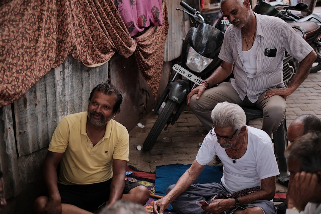 elderly men playing cards